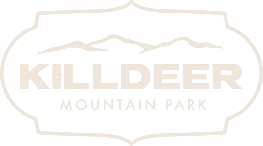 Killdeer Mountain Park logo in white with mountain outline and park name on a dark background